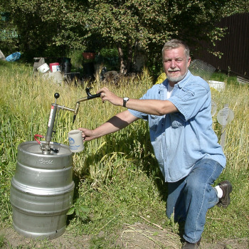 Leon Kania pouring a frosty one after a hard day's toil in the backyard barley patch